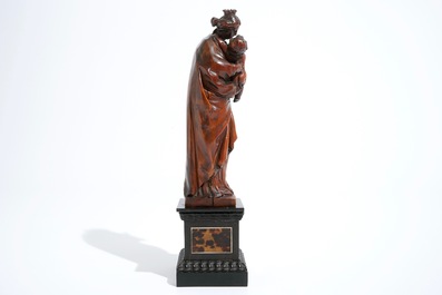 A carved boxwood Madonna with child on tortoise veneer base, 17th C.