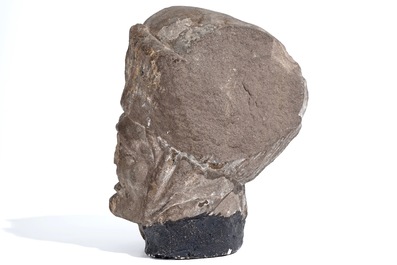 A Flemish carved stone bishop's head, 15/16th C.