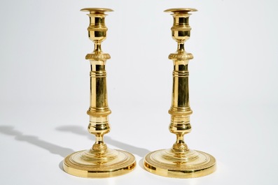 A pair of gilt bronze Empire candlesticks, France, 19th C.
