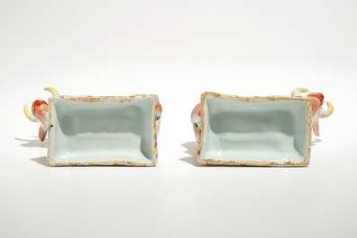 A pair of polychrome Dutch Delft petit feu cows on bases, 18th C.