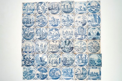 Een veld van 36 blauwwitte Delftse tegels met bijbels decor in medaillon, 18e eeuw