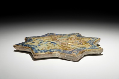 An Islamic luster glaze relief-decorated star tile, Kashan, Iran, 13th C.