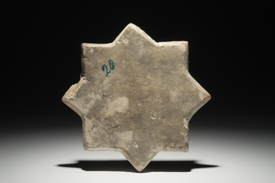 An Islamic luster glaze relief-decorated star tile, Kashan, Iran, 13th C.