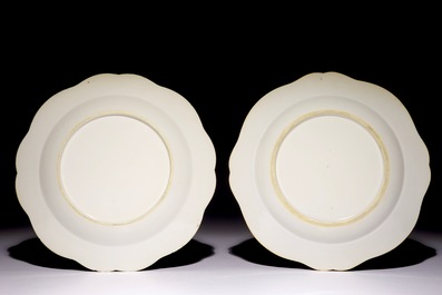 A pair of Chinese blue and white plates with animals in a garden, Qianlong