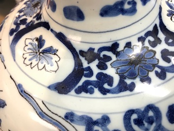 A pair of tall Dutch Delft blue and white chinoiserie vases, 1st half 18th C.