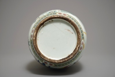 A large Chinese famille rose vase with peacocks and antiquities, 19th C.