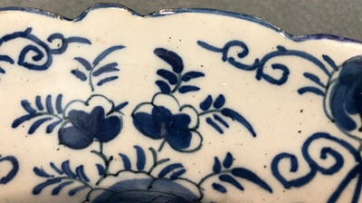 A pair of Dutch Delft blue and white "Tea Tree" dishes and a dish with a flower basket, 18th C.