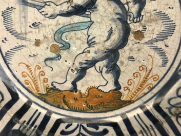 A rare Dutch Delft or Haarlem maiolica dish with a putto, 1st half 17th C.
