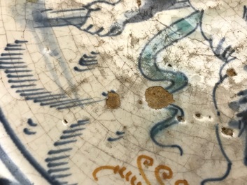 A rare Dutch Delft or Haarlem maiolica dish with a putto, 1st half 17th C.