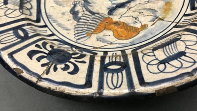 A rare Dutch Delft or Haarlem maiolica dish with a putto, 1st half 17th C.