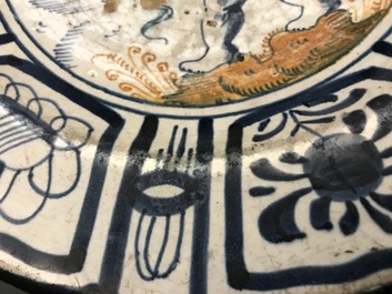 A rare Dutch Delft or Haarlem maiolica dish with a putto, 1st half 17th C.