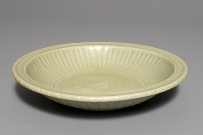A Chinese Longquan celadon charger with underglaze dragon, Ming