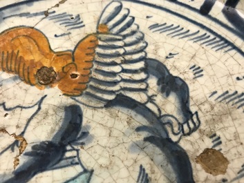 A rare Dutch Delft or Haarlem maiolica dish with a putto, 1st half 17th C.