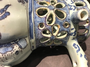 A Dutch Delft blue, white and manganese chinoiserie puzzle jug, dated 1690