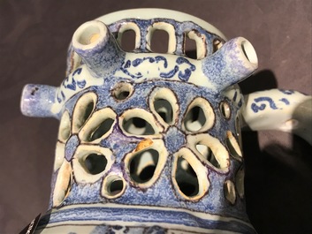 A Dutch Delft blue, white and manganese chinoiserie puzzle jug, dated 1690