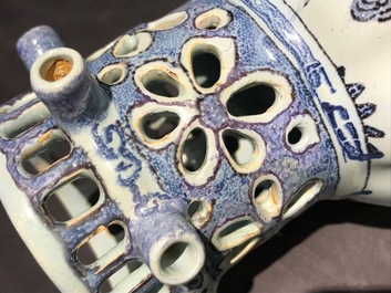 A Dutch Delft blue, white and manganese chinoiserie puzzle jug, dated 1690