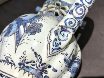 A Dutch Delft blue, white and manganese chinoiserie puzzle jug, dated 1690