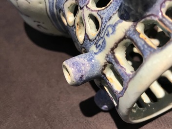 A Dutch Delft blue, white and manganese chinoiserie puzzle jug, dated 1690