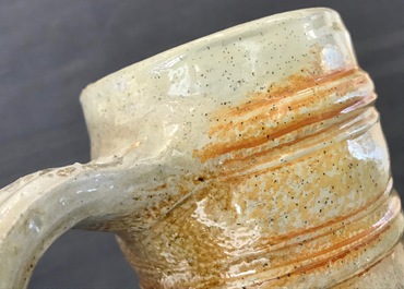 A large Raeren stoneware schnelle type mug with the arms of Frederick IV, dated 1604