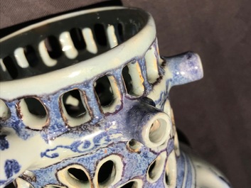 A Dutch Delft blue, white and manganese chinoiserie puzzle jug, dated 1690