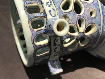 A Dutch Delft blue, white and manganese chinoiserie puzzle jug, dated 1690