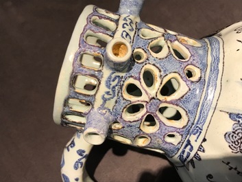 A Dutch Delft blue, white and manganese chinoiserie puzzle jug, dated 1690