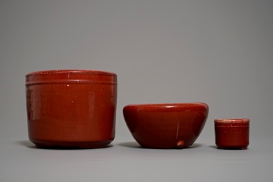Two Chinese oxblood-glazed brush pots and an incense burner, 19/20th C.