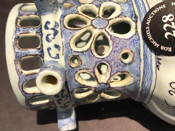 A Dutch Delft blue, white and manganese chinoiserie puzzle jug, dated 1690