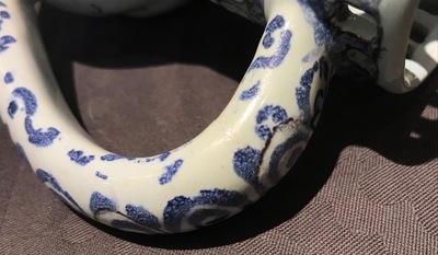 A Dutch Delft blue, white and manganese chinoiserie puzzle jug, dated 1690