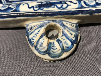 A Dutch Delft blue and white plaque with birds among flowers, 18th C.