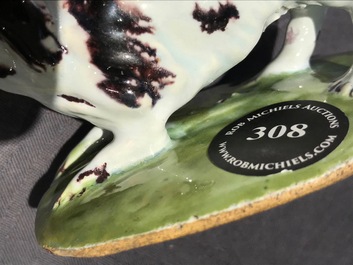 A polychrome Dutch Delft butter tub with a dog, 18th C.
