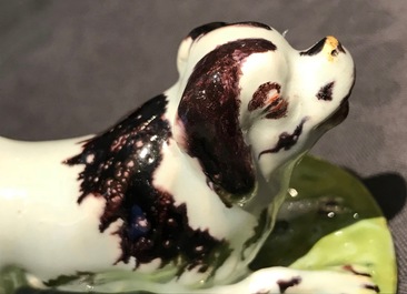 A polychrome Dutch Delft butter tub with a dog, 18th C.