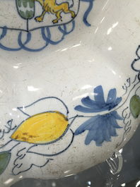 A Dutch Delft polychrome dish with the arms of Orange-Nassau, 2nd half 17th C.