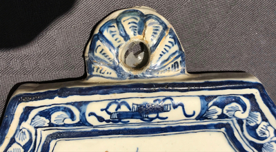 A Dutch Delft blue and white plaque with birds among flowers, 18th C.