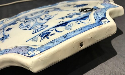 A Dutch Delft blue and white chinoiserie plaque with an elephant, 18th C.
