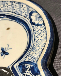 A Dutch Delft blue and white plaque with birds among flowers, 18th C.
