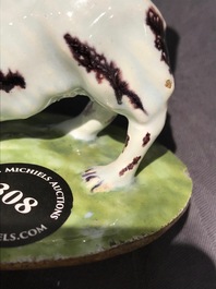 A polychrome Dutch Delft butter tub with a dog, 18th C.