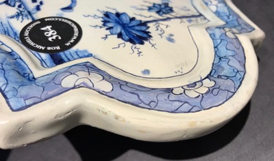 A Dutch Delft blue and white chinoiserie plaque with an elephant, 18th C.