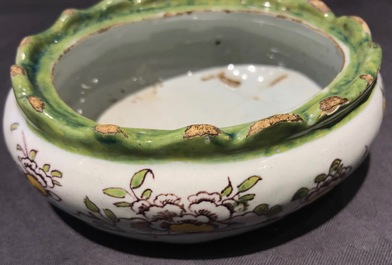 A polychrome Dutch Delft butter tub with a dog, 18th C.