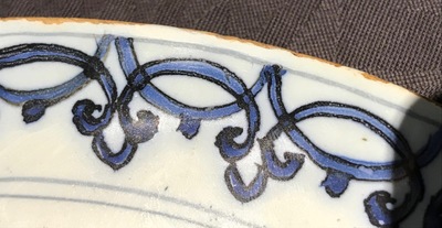 A Dutch Delft blue and white armorial plate, 17th C.