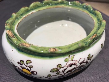 A polychrome Dutch Delft butter tub with a dog, 18th C.