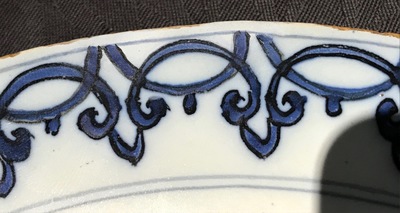A Dutch Delft blue and white armorial plate, 17th C.