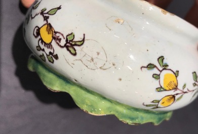 A polychrome Dutch Delft butter tub with a dog, 18th C.