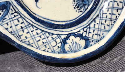 A Dutch Delft blue and white plaque with birds among flowers, 18th C.