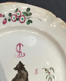 A French faience de l'Est plate with a bear, Les Islettes or Moustiers, 18th C.