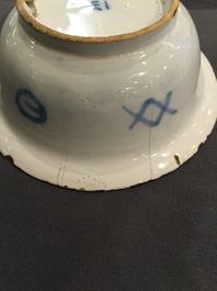 A Dutch Delft blue and white chinoiserie bowl and a polychrome Braunschweig mug, 1st half 18th C.