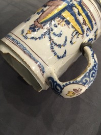 A Dutch Delft blue and white chinoiserie bowl and a polychrome Braunschweig mug, 1st half 18th C.