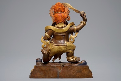 A Sino-Tibetan gilt bronze figure of Mahakala, 19th C.