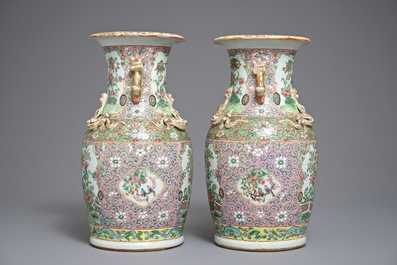 A pair of Chinese pink ground Canton vases, 19th C.