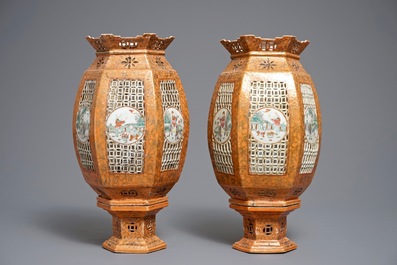 A pair of Chinese famille rose coral-ground lanterns, 19/20th C.